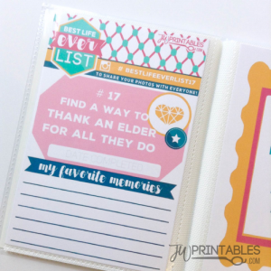 A printable card titled "BEST LIFE ever LIST" is displayed in a clear album sleeve, featuring challenge #17: "FIND A WAY TO THANK AN ELDER FOR ALL THEY DO," with sections for date completed and favorite memories.