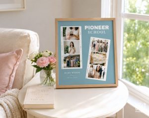 A light wood framed print with a light blue background displays "PIONEER SCHOOL", "MARA WILSON - 2026 - Austin, Texas", and multiple filmstrip-style photos of people and a decorated item, sitting on a white table next to a book titled "101 ESSAYS that will CHANGE the way YOU THINK" and a vase of flowers.