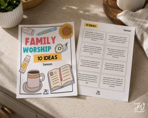 Two white sheets of paper with "Family Worship 10 Ideas Samson" printed on them are displayed on a light-colored countertop, with the left sheet featuring colorful illustrations and the right sheet listing ten activity ideas related to Samson.